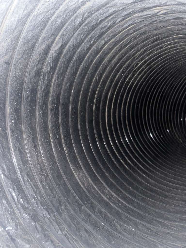 Chimney flue after professional sweep — clean liner surface — Dallas TX
